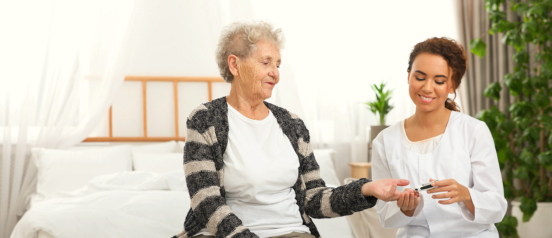 caregiver cutting her patient nails